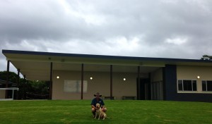 Tony and Keith the dog at Casuarina Hockey club after they installed the new green hill 